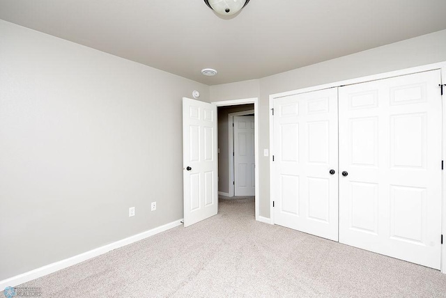 1170 Highland Ln W, West Fargo, ND 58078 - unfurnished bedroom featuring light colored carpet and a closet