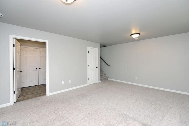 1170 Highland Ln W, West Fargo, ND 58078 - carpeted spare room featuring baseboards and stairway