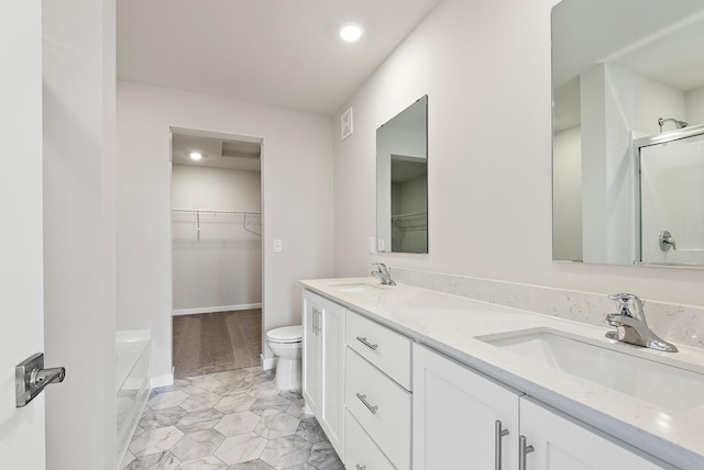 39726 Fallbrook Ave, North Branch, MN 55056 - full bathroom featuring double vanity, recessed lighting, a shower with door, and a walk in closet