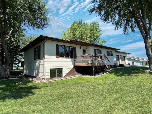 402 Range Rd, Springfield, MN 56087 - back of house featuring a wooden deck and a yard