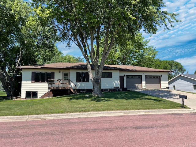 402 Range Rd, Springfield, MN 56087 - ranch-style home with concrete driveway, a front lawn, and an attached garage
