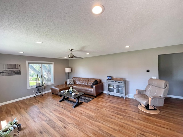 402 Range Rd, Springfield, MN 56087 - living area with a textured ceiling, light wood-type flooring, recessed lighting, and a ceiling fan