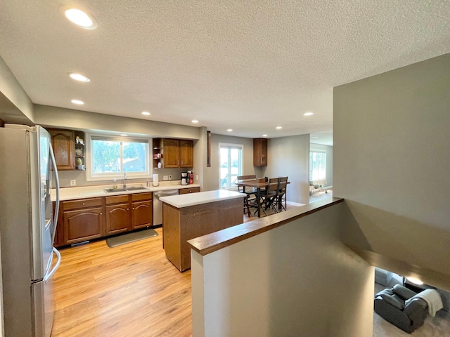 402 Range Rd, Springfield, MN 56087 - kitchen featuring stainless steel appliances, open shelves, recessed lighting, light wood-type flooring, and a textured ceiling
