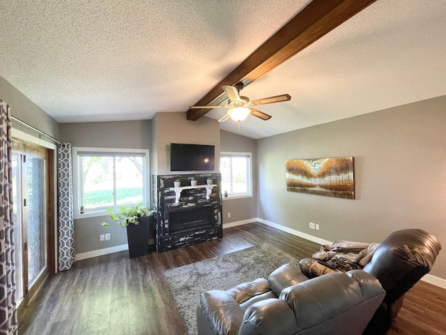 402 Range Rd, Springfield, MN 56087 - living room with wood finished floors, a textured ceiling, a ceiling fan, and a fireplace