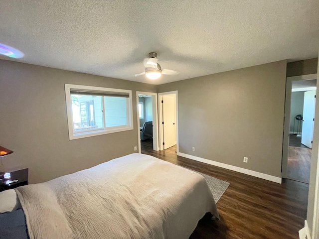 402 Range Rd, Springfield, MN 56087 - bedroom with dark wood-type flooring, a textured ceiling, and ceiling fan