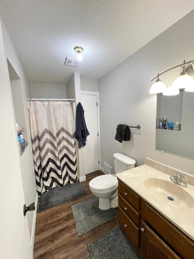 402 Range Rd, Springfield, MN 56087 - full bathroom featuring wood finished floors, vanity, a textured ceiling, and curtained shower