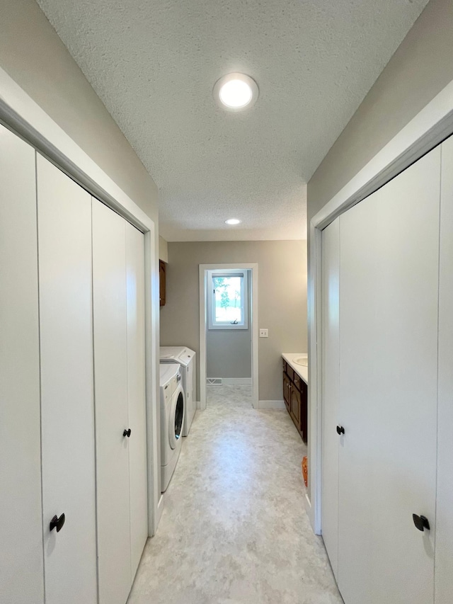 402 Range Rd, Springfield, MN 56087 - laundry area featuring washing machine and dryer, a textured ceiling, and recessed lighting