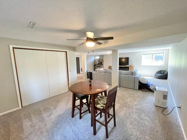 402 Range Rd, Springfield, MN 56087 - dining room featuring carpet floors, a textured ceiling, and ceiling fan