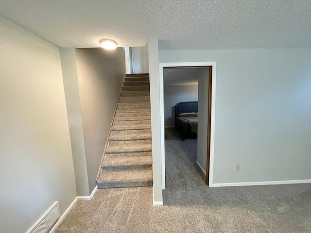 402 Range Rd, Springfield, MN 56087 - stairs with carpet flooring and a textured ceiling