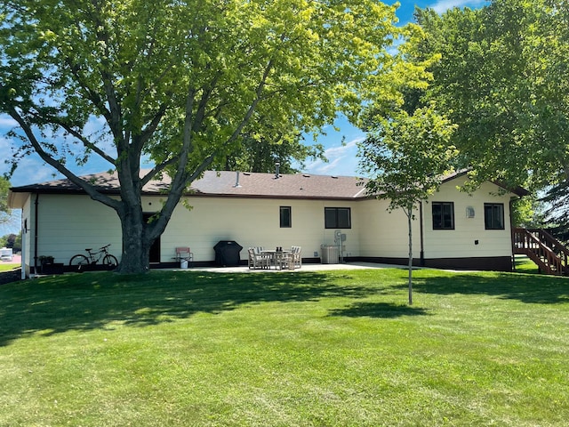 402 Range Rd, Springfield, MN 56087 - back of house with a patio area, a lawn, and stairway