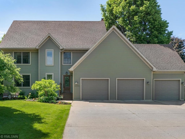 10905 35th Pl N, Plymouth, MN 55441 - colonial house with driveway, a garage, a front lawn, a chimney, and roof with shingles