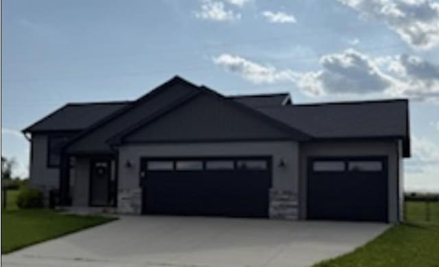 1005 15th Ave NW, Kasson, MN 55944 - view of front of house with a garage and driveway