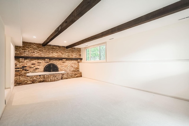 8222 Brandywine Pkwy, Brooklyn Park, MN 55444 - unfurnished living room with a brick fireplace, carpet flooring, beamed ceiling, and brick wall