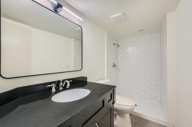 8222 Brandywine Pkwy, Brooklyn Park, MN 55444 - bathroom featuring vanity, a tile shower, and tile patterned floors