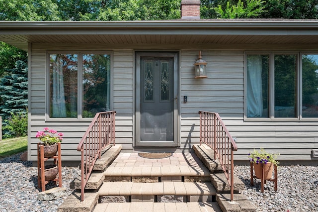 1322 Bidwell St, West Saint Paul, MN 55118 - doorway to property featuring a chimney