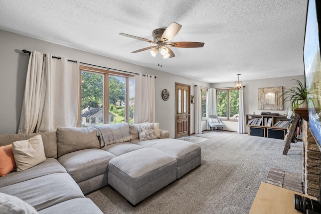 1322 Bidwell St, West Saint Paul, MN 55118 - carpeted living area with ceiling fan, a textured ceiling, and a chandelier
