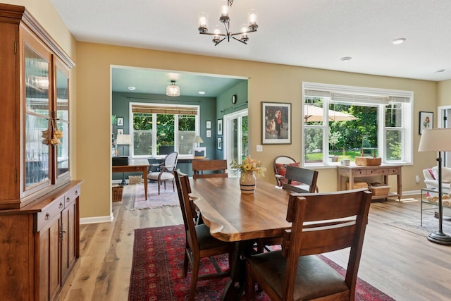 1101 Fabel Ln, Waconia, MN 55387 - dining area featuring light wood-style floors, a chandelier, an office area, and recessed lighting