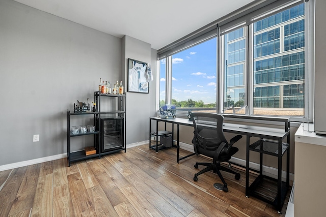 8151 33rd Ave S Unit 201, Bloomington, MN 55425 - office area featuring wood finished floors and a bar