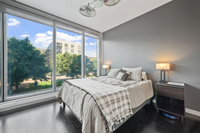 8151 33rd Ave S Unit 201, Bloomington, MN 55425 - bedroom featuring dark wood-style floors and expansive windows
