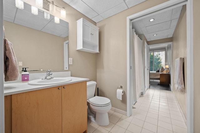 8151 33rd Ave S Unit 201, Bloomington, MN 55425 - full bath with a paneled ceiling, vanity, tile patterned floors, and a shower with curtain