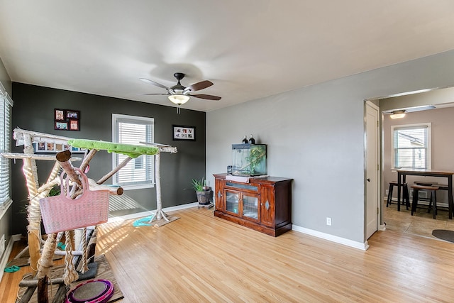2074 Mcknight Rd N, North Saint Paul, MN 55109 - interior space with wood finished floors, ceiling fan, and plenty of natural light