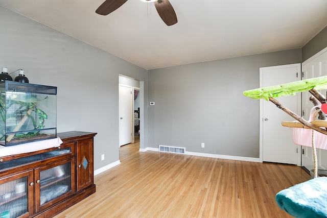 2074 Mcknight Rd N, North Saint Paul, MN 55109 - sitting room with light wood finished floors and ceiling fan