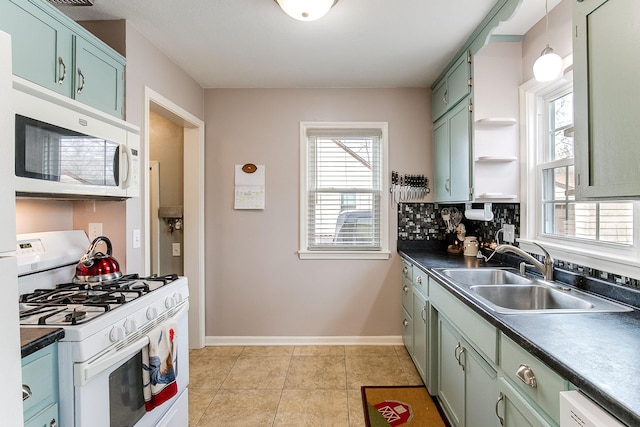 2074 Mcknight Rd N, North Saint Paul, MN 55109 - kitchen with white appliances, green cabinets, dark countertops, light tile patterned floors, and open shelves