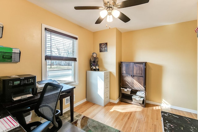2074 Mcknight Rd N, North Saint Paul, MN 55109 - office with light wood finished floors and ceiling fan