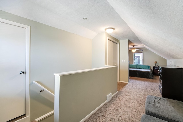 2074 Mcknight Rd N, North Saint Paul, MN 55109 - carpeted bedroom with vaulted ceiling and a textured ceiling