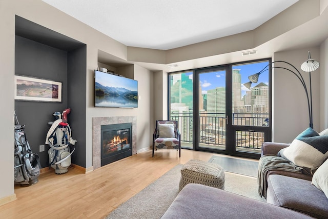 500 Grant St Unit 2109, Minneapolis, MN 55404 - living room featuring wood finished floors and a tile fireplace