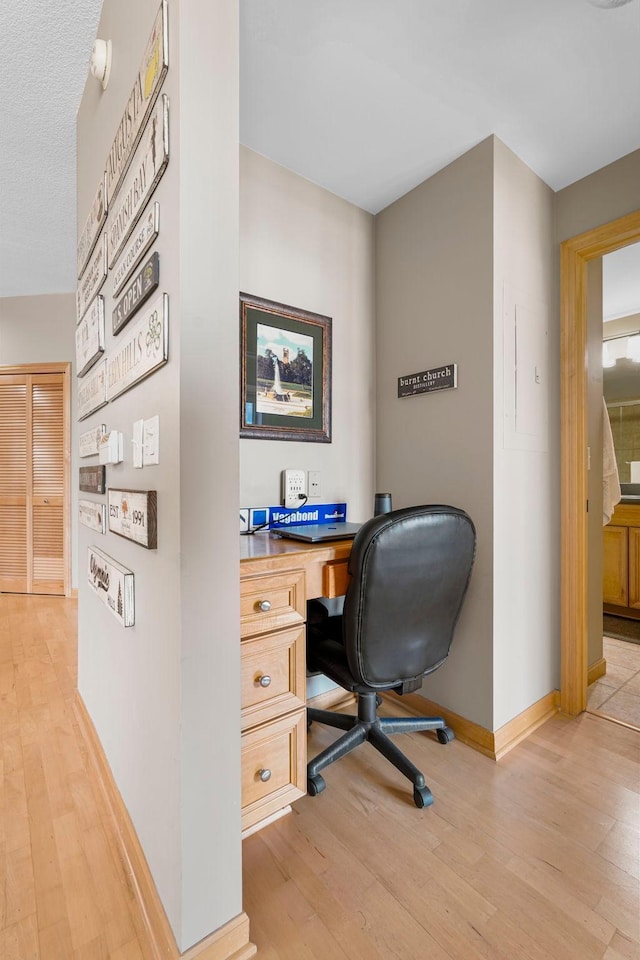 500 Grant St Unit 2109, Minneapolis, MN 55404 - office area with light wood finished floors and built in desk