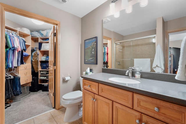 500 Grant St Unit 2109, Minneapolis, MN 55404 - full bath featuring vanity, tile patterned flooring, a spacious closet, and a stall shower