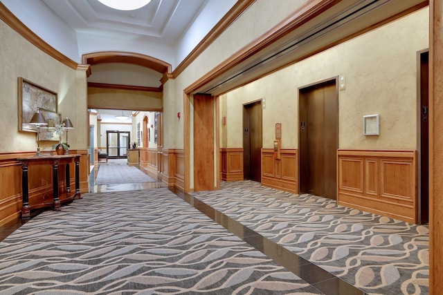 500 Grant St Unit 2109, Minneapolis, MN 55404 - hallway featuring elevator, inlaid floor details, tile patterned flooring, wainscoting, and ornamental molding