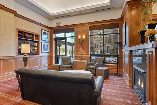 500 Grant St Unit 2109, Minneapolis, MN 55404 - living room with a glass covered fireplace, a decorative wall, carpet floors, built in features, and wainscoting