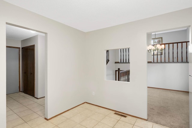 5698 Turtle Lake Rd, Shoreview, MN 55126 - empty room with a chandelier and baseboards