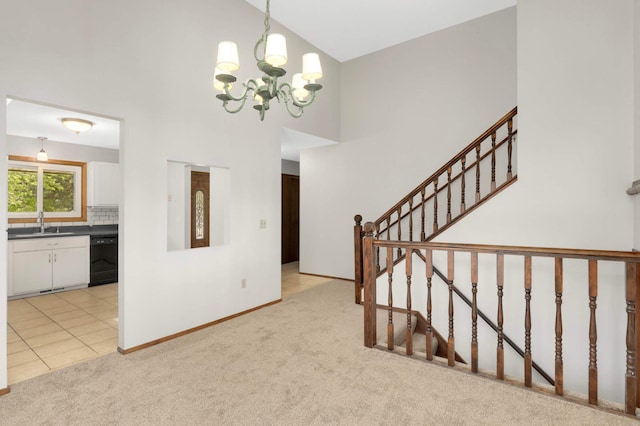 5698 Turtle Lake Rd, Shoreview, MN 55126 - foyer featuring light carpet, a chandelier, a towering ceiling, light tile patterned floors, and stairway