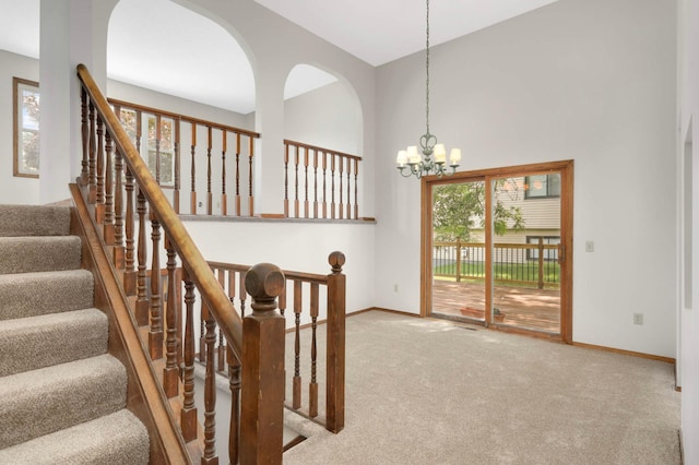 5698 Turtle Lake Rd, Shoreview, MN 55126 - stairs featuring carpet floors, a chandelier, and a towering ceiling