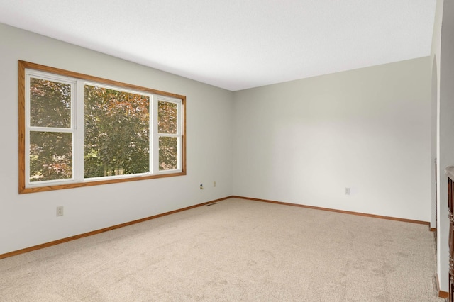 5698 Turtle Lake Rd, Shoreview, MN 55126 - unfurnished room featuring light carpet and baseboards