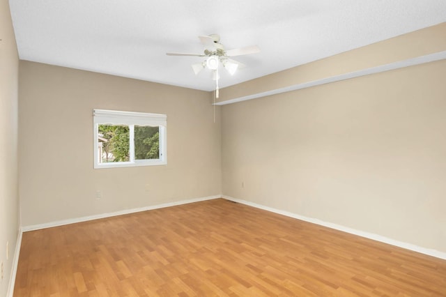 5698 Turtle Lake Rd, Shoreview, MN 55126 - empty room featuring light wood finished floors and a ceiling fan