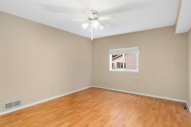 5698 Turtle Lake Rd, Shoreview, MN 55126 - unfurnished room featuring light wood finished floors and a ceiling fan
