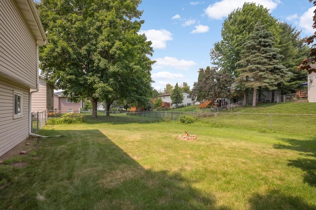 5698 Turtle Lake Rd, Shoreview, MN 55126 - fenced backyard featuring an outdoor fire pit