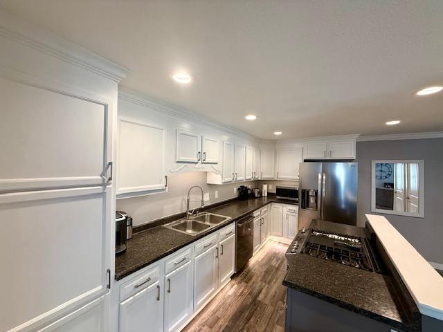 713 Grove St E, Caledonia, MN 55921 - kitchen featuring stainless steel fridge with ice dispenser, dishwasher, fridge, ornamental molding, and a kitchen island