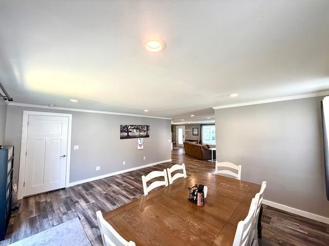 713 Grove St E, Caledonia, MN 55921 - unfurnished dining area featuring ornamental molding, recessed lighting, and wood finished floors