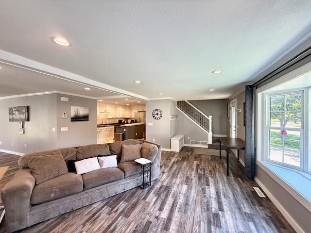 713 Grove St E, Caledonia, MN 55921 - living area with dark wood-type flooring, stairway, crown molding, and recessed lighting
