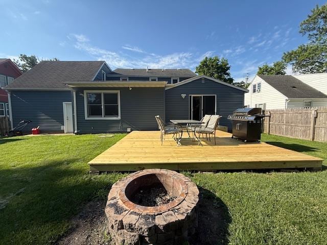 713 Grove St E, Caledonia, MN 55921 - back of property with an outdoor fire pit and a deck
