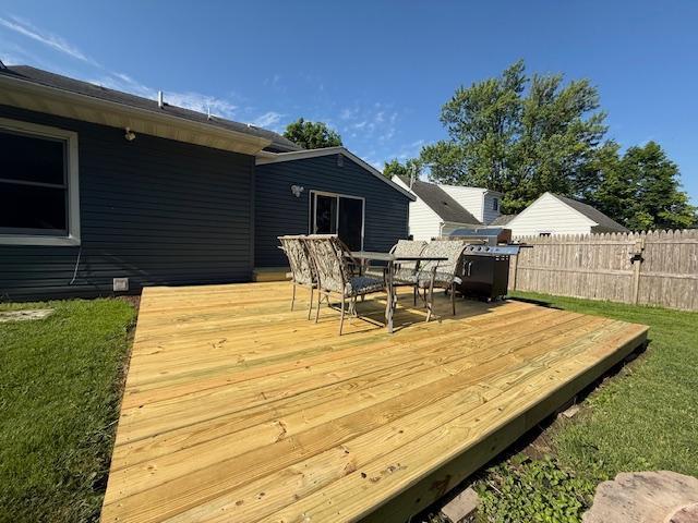 713 Grove St E, Caledonia, MN 55921 - wooden terrace featuring outdoor dining space and a grill