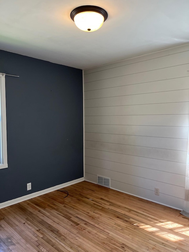1017 Sibley Ave S, Litchfield, MN 55355 - spare room featuring hardwood / wood-style floors and baseboards