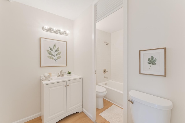 15 1st St Unit A307, Minneapolis, MN 55401 - full bathroom with vanity, wood finished floors, and bathtub / shower combination