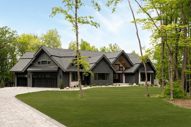 6176 Broadview Ave, Credit River Twp, MN 55372 - modern farmhouse style home with decorative driveway, a front lawn, a shingled roof, and board and batten siding