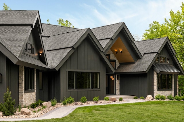 6176 Broadview Ave, Credit River Twp, MN 55372 - view of front facade with roof with shingles, a front yard, stone siding, and board and batten siding